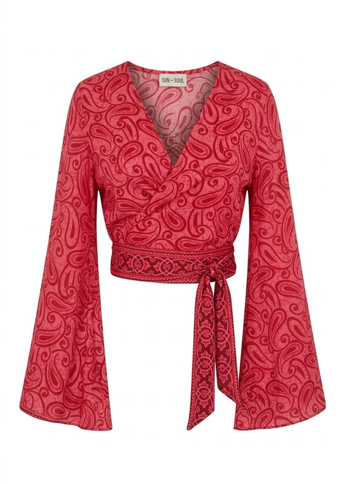 Red patterned blouse with bell sleeves on a white background