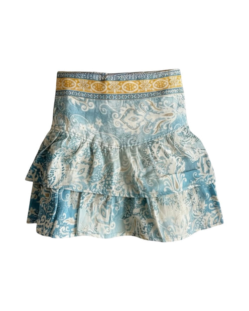 Patterned skirt with ruffled layers on a white background