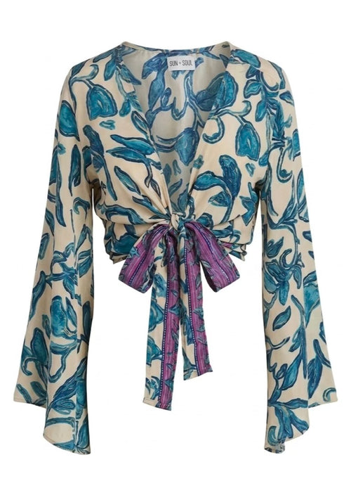 Long-sleeve top with blue floral pattern on a white background