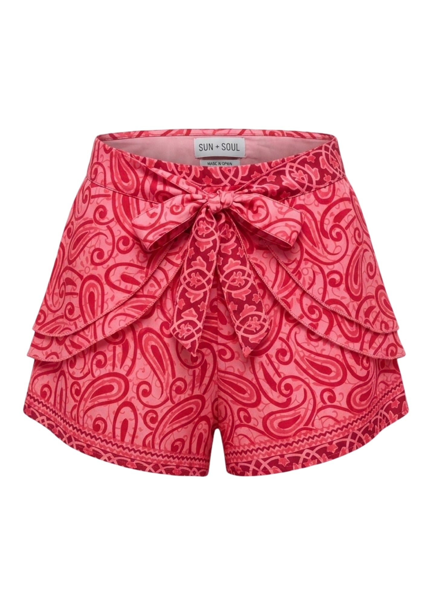 Red patterned shorts with a bow on a white background