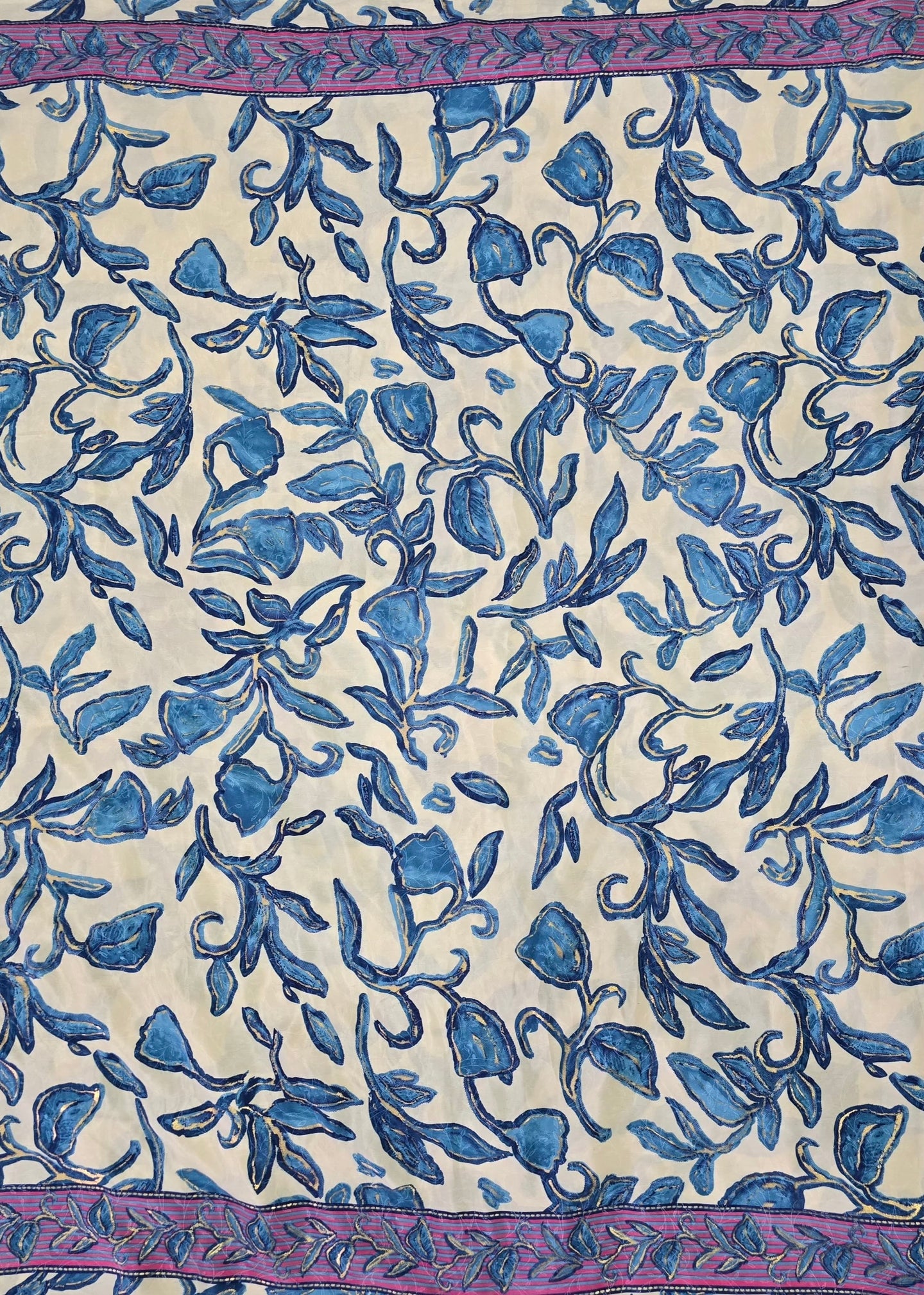 Textile with blue floral pattern on a beige background