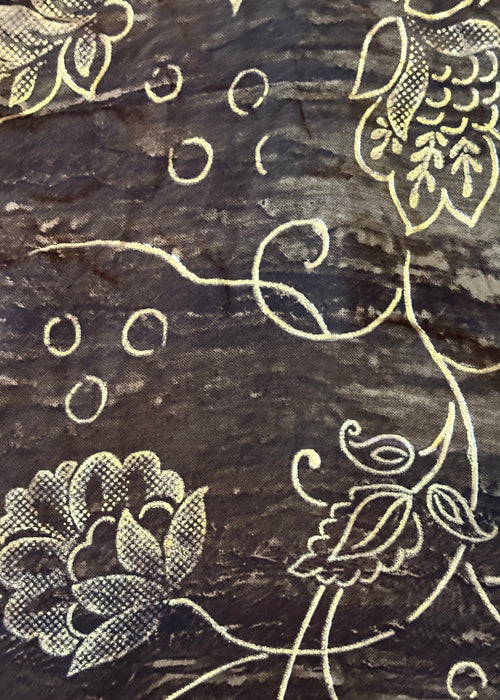 Decorative floral patterns on a textured dark surface